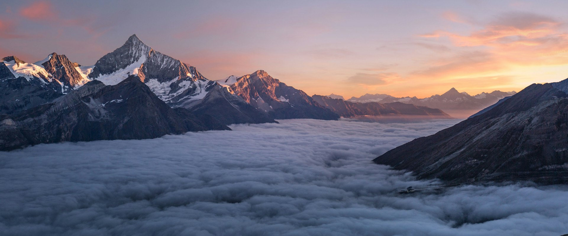 Misty mountain landscape at sunrise, reminiscent of Haiti's Central Plateau