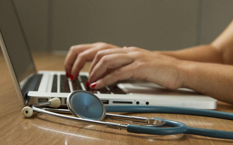 Healthcare workers providing medical care in a community setting